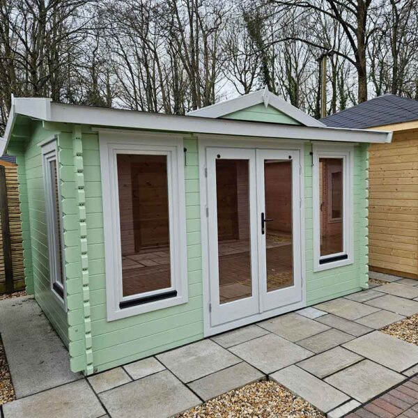 Thorndown-Parlyte-Green-and-Greymond-Wood-Paint-on-Fencing-Centre-Mini-Weymouth-Cabin