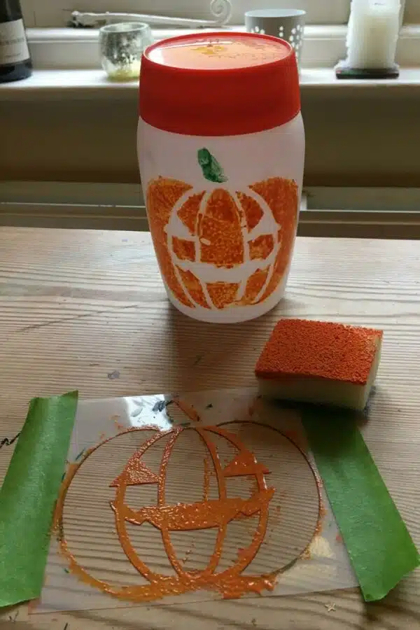 Sponging-on-Ogre-Orange-Peelable-Glass-Paint-with-stencil
