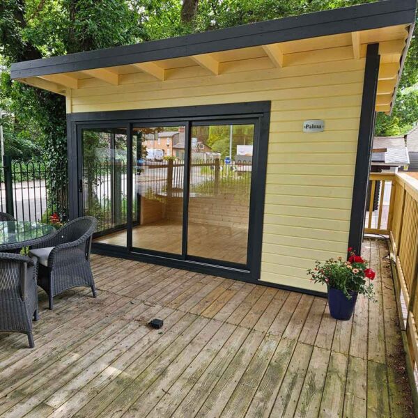 Thorndown-Meadowsweet-Cream-and-Anthracite-Grey-on-Fencing-Centre-Palma-Cabin