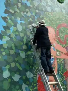 Frank-painting-last-leaf-on-Adam-and-Eve-mural