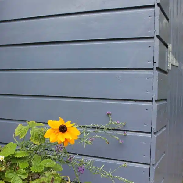 Thorndown-Hartlake-Blue-Wood-Paint-on-shed-with-flowers