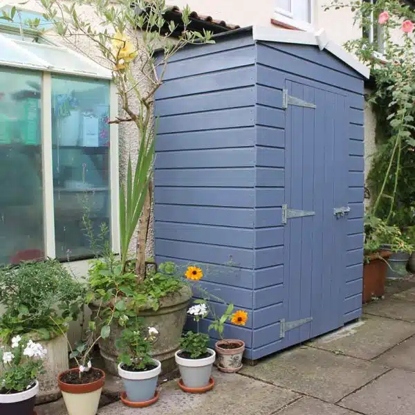 Thorndown-Hartlake-Blue-with-Whey-White-trim-Wood-Paint-on-shed