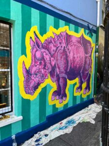 Frank-Harwood-Pink-Rhino-Glastonbury-Mural_Thorndown-Wood-Paint_4